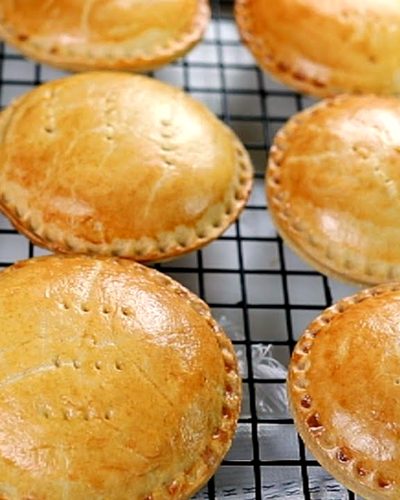 Golden mini chicken pies fresh from the oven